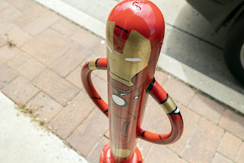 Iron Man patrols First Street near the front of Paper Escape in Dixon.