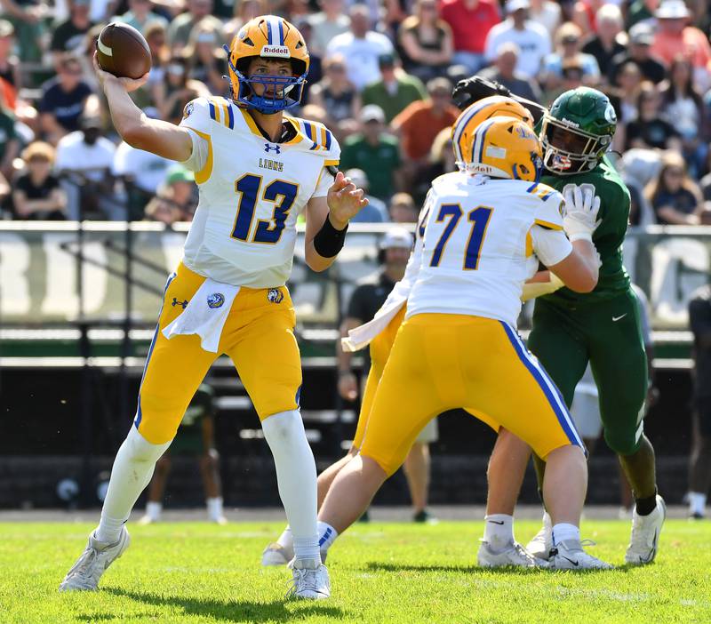 Lyons Township quarterback Jack Slightom fires a pass from behind the block of Jacob Radecki (71) during a game against Glenbard West on September 27, 2025 at Glenbard West High School in Glen Ellyn.