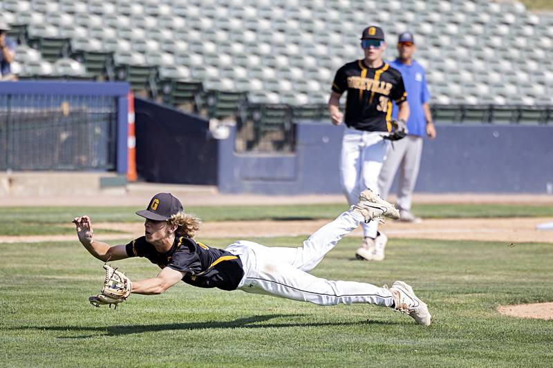 Goreville’s Hunter Francis dives and catches a bunt pop up against Newman Saturday, June 3, 2023 during the IHSA class 1A third place baseball game.