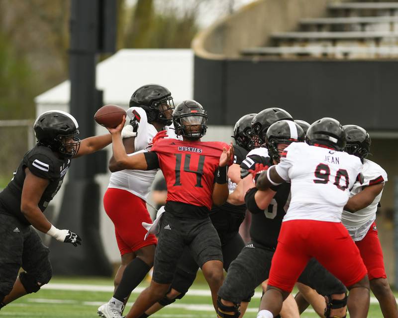 Northern Illinois University's Jalen Macon (14) gets a pass off during a scrimmage on Saturday April 27, 2024, held at Huskie Stadium in DeKalb.