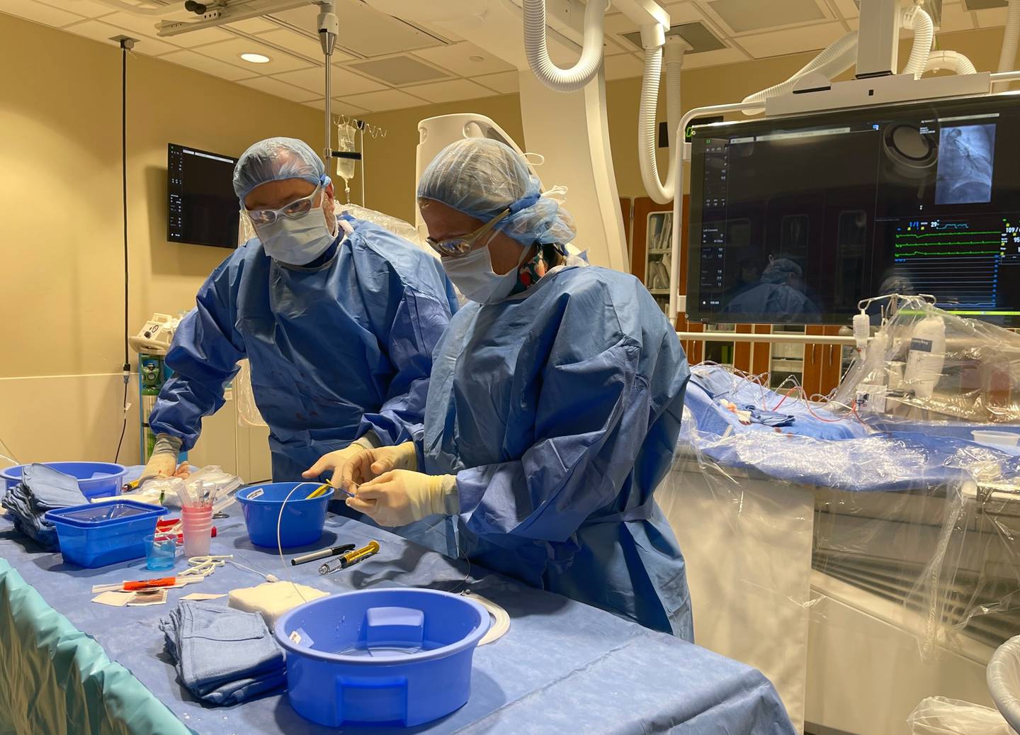 Interventional Cardiologist at Northwestern Medicine Kishwaukee Hospital, Christopher Berry and another other doctor work with the CardioMEMs device during a surgical procedure last month.