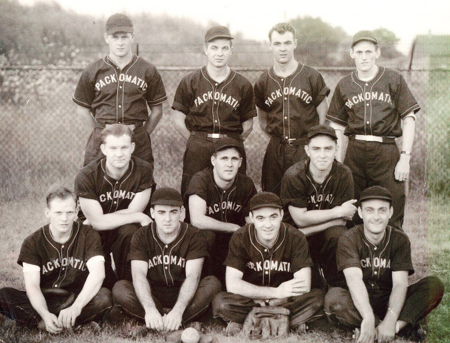 Glenn Masek of Joliet played football at the former Joliet Catholic High School, and was interested in sports for all of his life, as a participant and a fan.  He played softball for the Packomatic team in Joliet.  This photo was taken at Heggie Field in Joliet, on July 16, 1946, after Packomatic defeated Weber Dairy in a 17-12 slugfest.  In the photo are, front row, left to right, Hank Phillips, Art Burns, Bob McGuire and Dick McGuire; middle row, Rich Young, Glenn Masek, Tom Rink; and top row, Fran DePratt, John Daly, Jack Knarr and Ray Phillips.