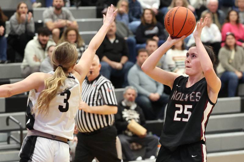 Prairie Ridge's Addie Meyer shoots over Kaneland's Alexis Schueler Thursday, Feb 15, 2024, during their Class 3A regional final game at Kaneland High School in Maple Park.