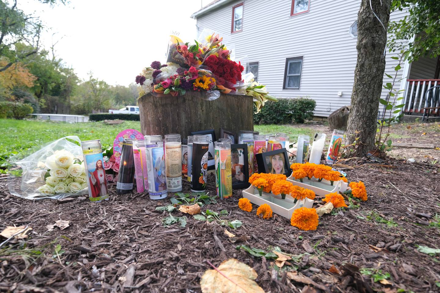 The memorial for Jonathan Ceballos and Holly Mathews, both 22, continues to grow outside the home of Oct. 31st mass shooting at a Halloween Party in Joliet on Wednesday, Nov. 3, 2021.