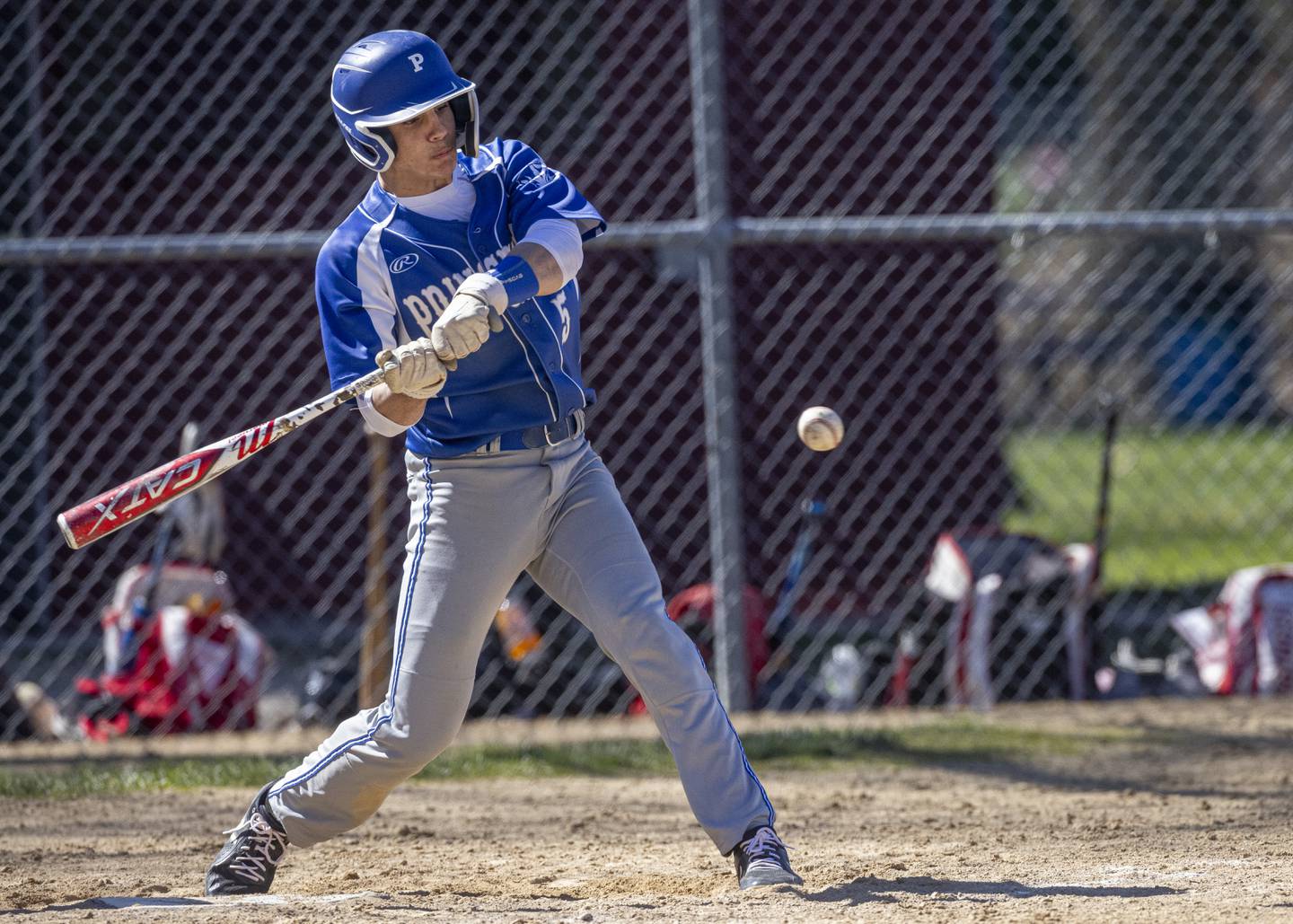 Ace Christiansen tries to square up the ball against Hall at Foley Field on April 6, 2024.