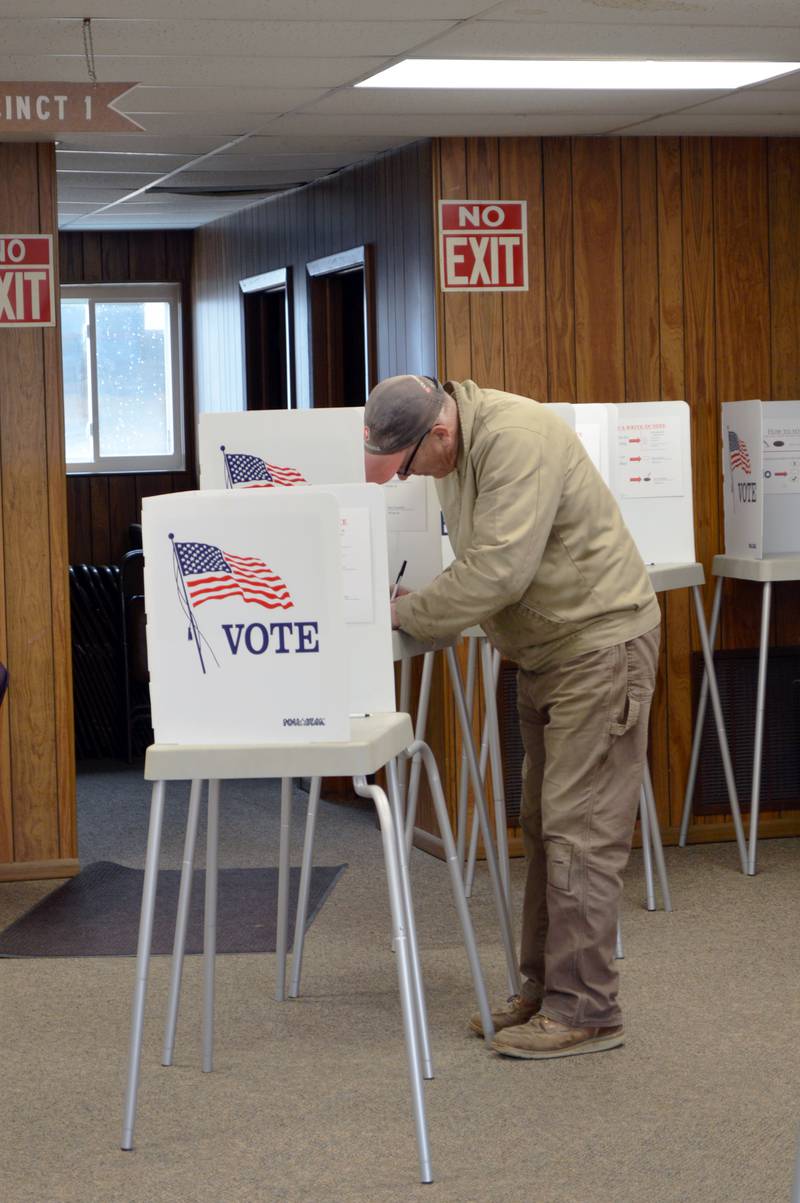 Chip Braker fills out his ballot for the consolidated election in the Forreston Township building on April 4, 2023. About 80 people had voted in the precinct as of 3:06 p.m.