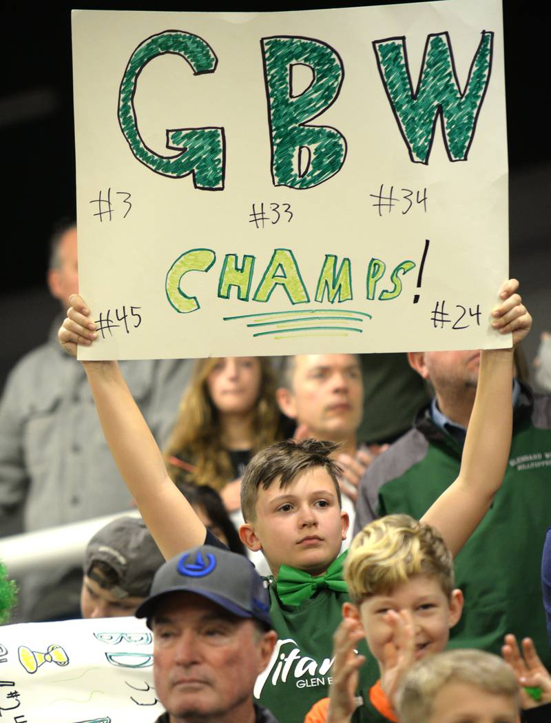 Glenbard West fans including Charlie Kammes cheer for the state basketball during the pep rally held Sunday March 13, 2022.