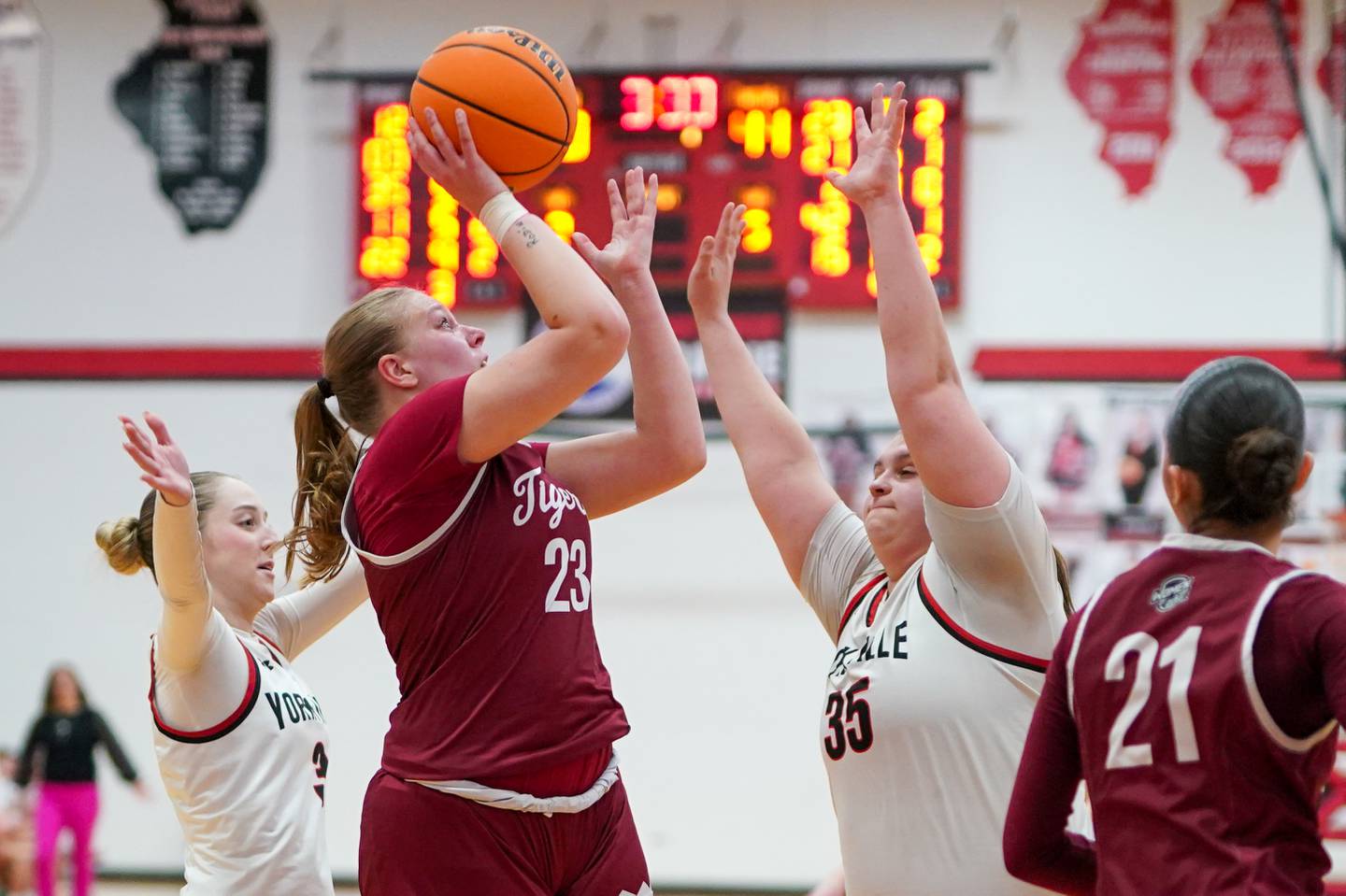 Plainfield North's Isabella Gruber (23) shoots the ball in the post over Yorkville's Madison Spychalski (35) during a basketball game at Yorkville High School on Tuesday, January 11, 2017.