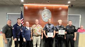 Yorkville police officer and fireman presented Lifesaving Award by the city