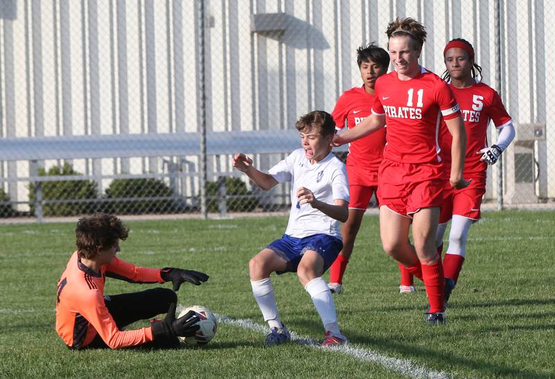 Ottawa keeper Brady Wendt blocks a kick by Princeton's Parker Nink on Tuesday, Oct. 3, 2023 at Ottawa High School.