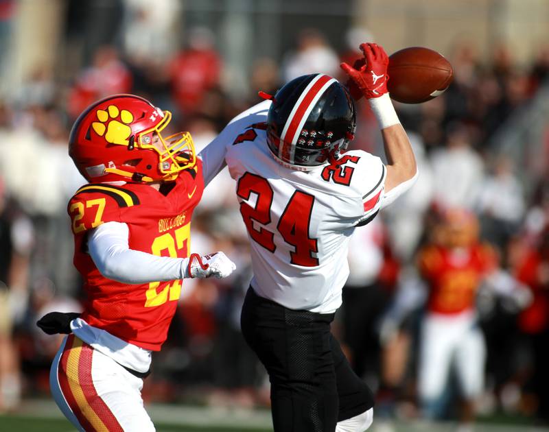 Batavia’s Mason Kuhn (left) breaks up a pass to Lincoln-Way Central’s Jimmy Herget during the Class 7A second round playoff game in Batavia on Saturday, Nov. 4, 2023.