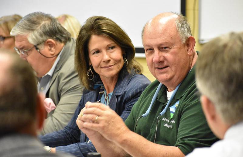 U.S Rep. Cheri Bustos listens as Sterling Mayor Skip Lee shares his thoughts on local wages. Lee and others spoke with the East Moline Democrat about issues they say must be addressed to improve the future of the region at a roundtable discussion Thursday at the Whiteside Area Career Center.