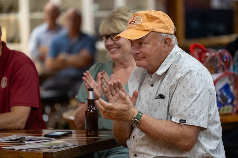 Larry Langston claps during speech at the 'Guns Save Life' event on Thursday, Aug 21, 2025 at Jamie's Outpost in Utica.