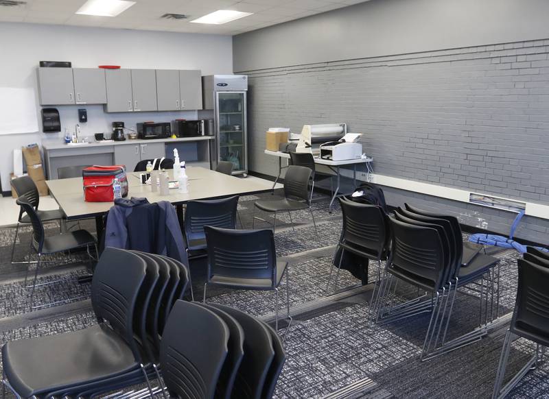 One of two old locker rooms that have been repurposed into a staff, lounge and work room on Wednesday, Jan. 26, 2022, at Harvard High School. The room is part of a $5.5 million renovation that added new locker rooms, a training room, wrestling room, and a weight and fitness area, along with repurposing the old locker rooms.