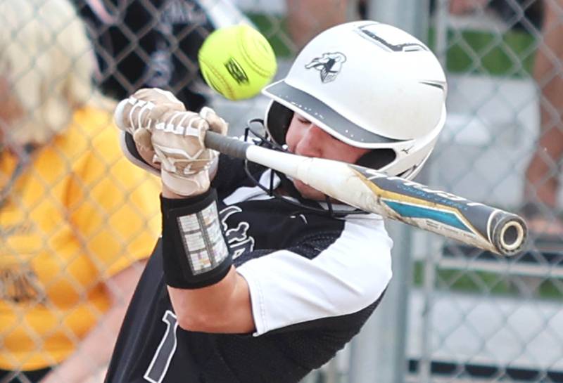 Kaneland's Kailey Plank makes contact with a high pitch Tuesday, May 31, 2022, during their Class 3A Sectional semifinal game against Sterling at Sycamore High School.