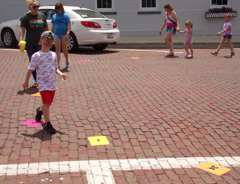 Families participate in a game similar to musical chairs Saturday, June 3, 2023, during the Shrimp and Brew Hullabaloo in Princeton.