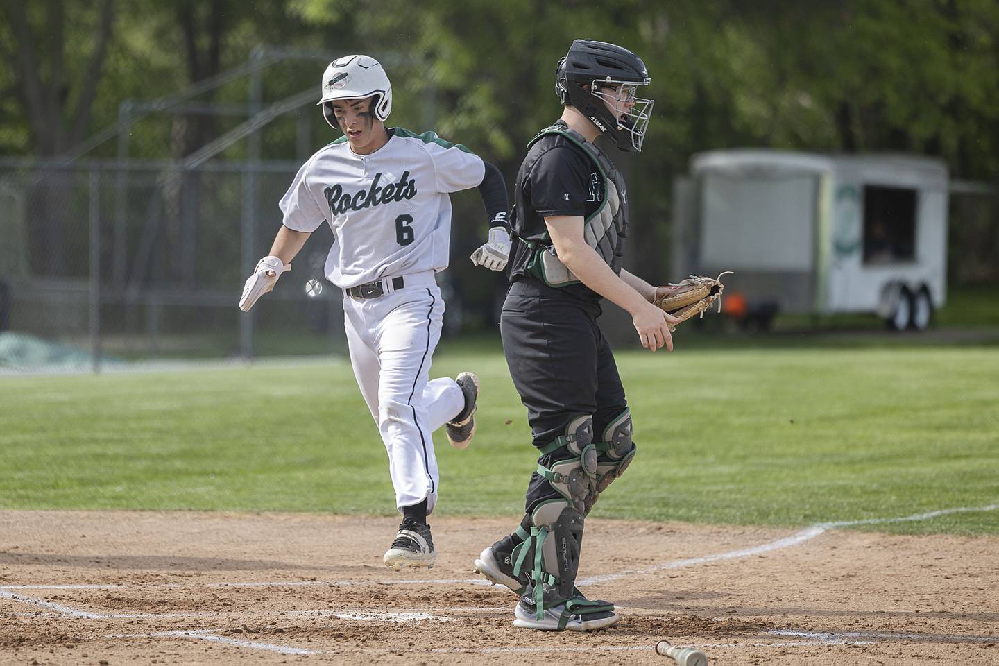 Rock Falls’ Austin Castaneda comes in to score the Rockets’ first run of the game against West Carroll in a regional quarterfinal game Monday, May 15, 2023.