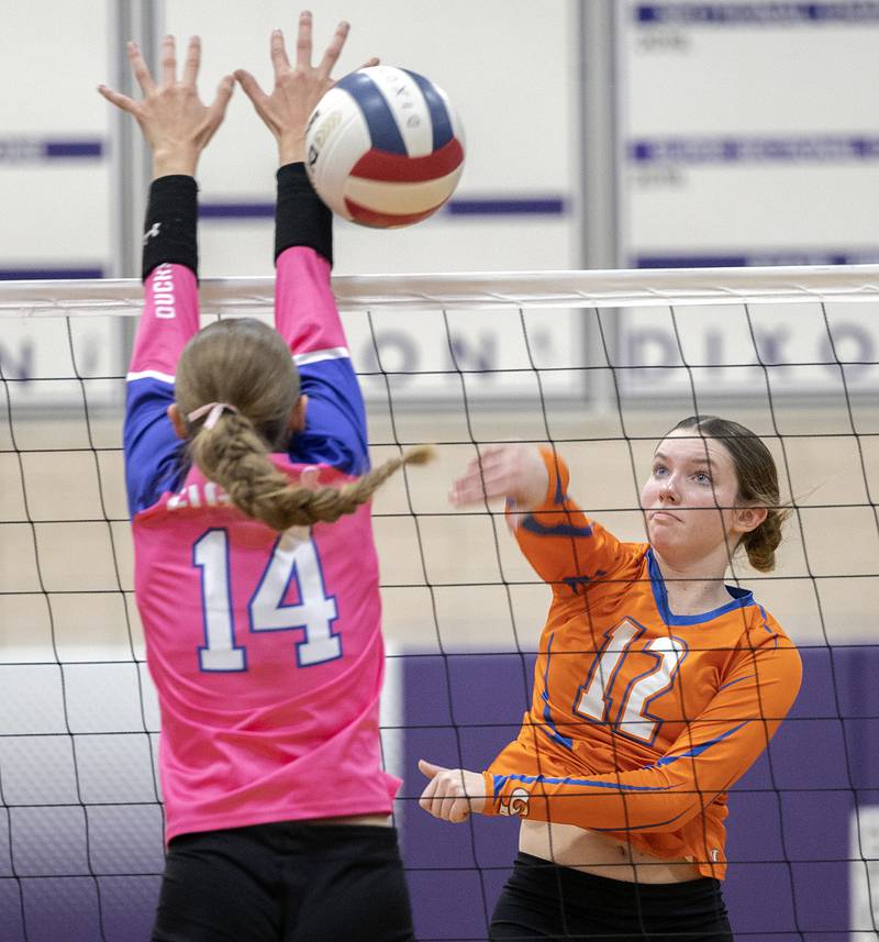 Genoa-Kingston’s Jessie Fredrickson spikes against Dixon’s Leah Carlson Thursday, Oct. 17, 2024.