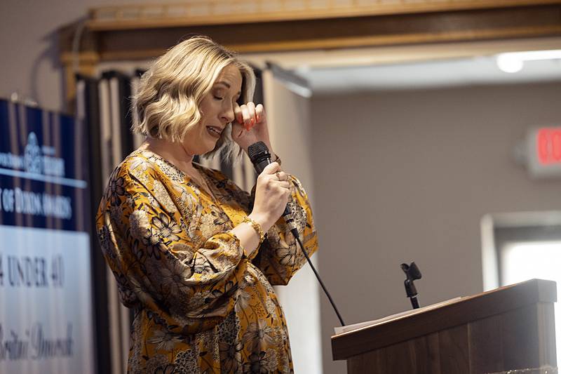 Britni Dvorak wipes away a tear after having been awarded one of the Four under 40 awards Friday, April 5, 2024 at the Best of Dixon Awards.