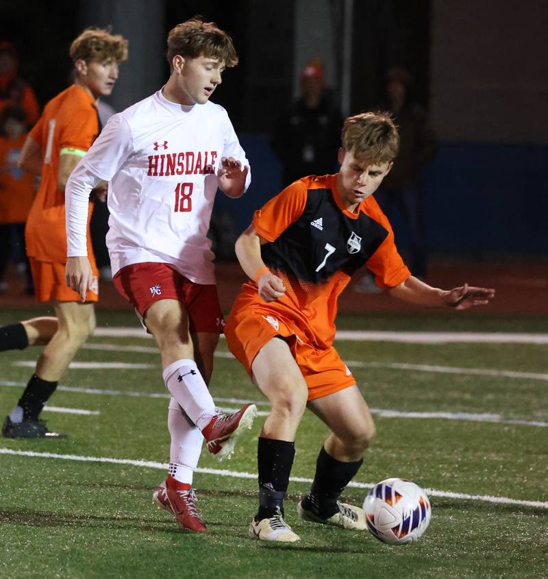 Hinsdale Central's Austen Szurgot  kicks the ball away from Hersey's Nik Van De Mark Friday, Nov. 8, 2024, during their Class 3A state semifinal game at Hoffman Estates High School.