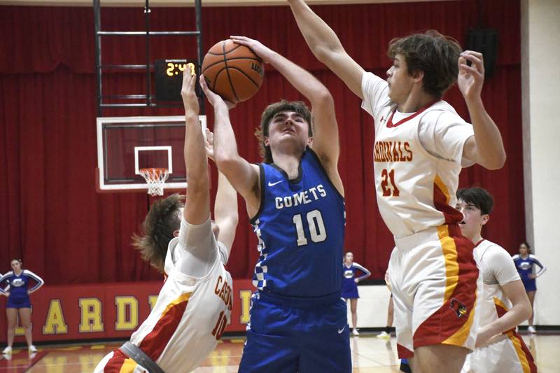 Clifton Central's Blake Chandler elevates for a shot while guarded by St. Anne's Trevor Van Pelt and Grant Pomaranski during St. Anne's 61-56 victory over Clifton Central on Tuesday January 6, 2026.