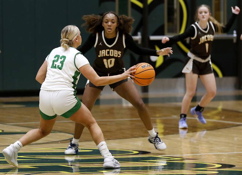 Jacobs' Zara Lewis (center) gourds Crystal Lake South's Laken Lepage during a Fox Valley Conference basketball game on Friday, Jan. 17, 2025, at Crystal Lake South High School.