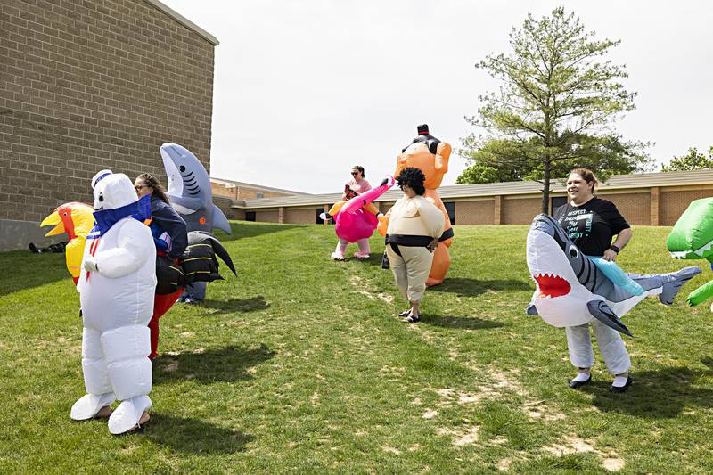 Parents and friend of Reagan Middle Schooler’s 8th graders showed up Thursday, May 25, 2023 in full costume as a way to cheer, celebrate and maybe slightly embarrass their kids on their final day of classes before high school. Nearly 20 costume wearing supporters converged on the school for the morning of fun.