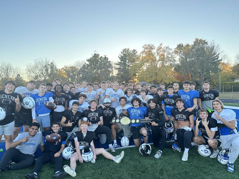 Geneva quarterback Tony Chahino (bottom row, fifth on right) holds the Friday Night Drive Team of the Week belt with his teammates.