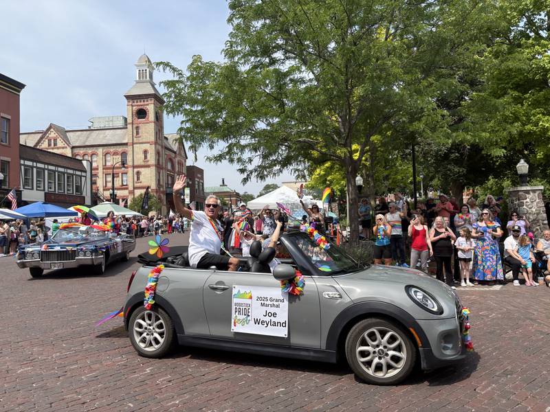 Grand Marshal Joe Weyland waves during the Woodstock Pride parade June 15, 2025.