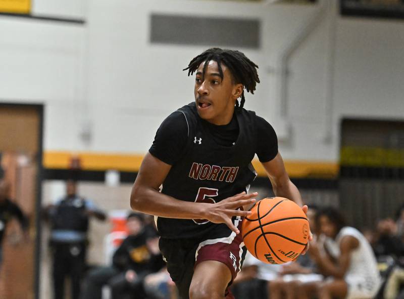 Plainfield North's Darin Ashiru (5) drives to the basket during a conference game against Joliet West on Friday, Dec. 20, 2024, at Joliet.