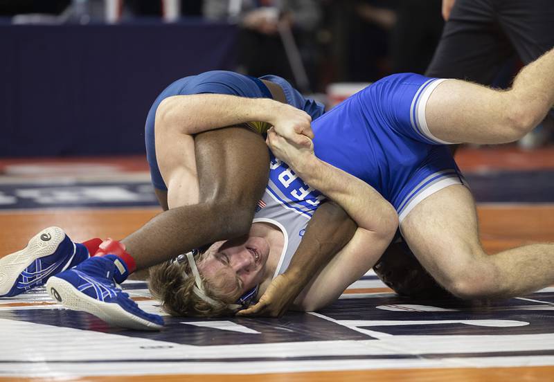 Princeton’s Casey Etheridge (bottom) is worked on by Althoff’s Pierre Walton in the 1A 165 pound class Saturday, Feb. 21, 2026, at the IHSA wrestling finals in Champaign.