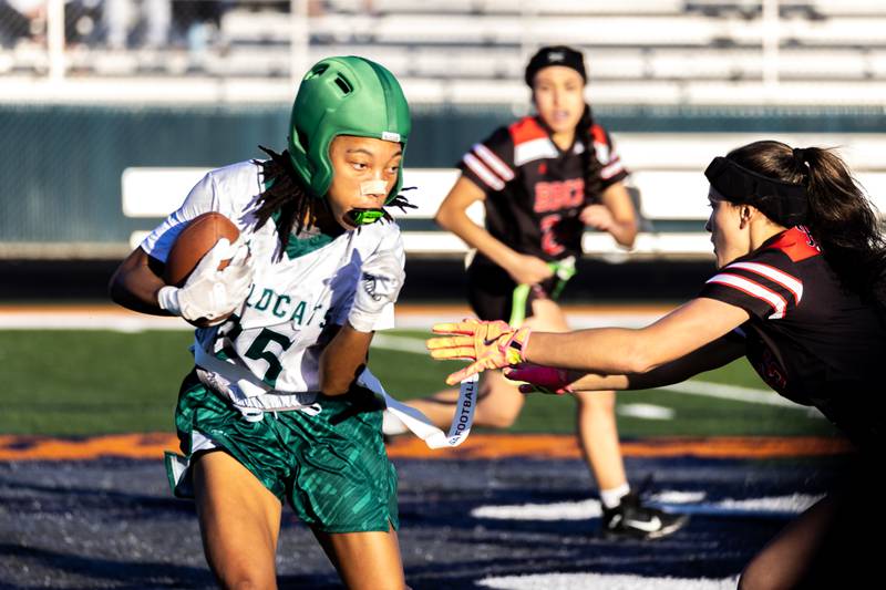 Plainfield Central's Shania Davison dodges the defense during a varsity flag football Romeoville Regional semifinal game against Bradley-Bourbonnais at Romeoville on Oct. 7, 2025.
