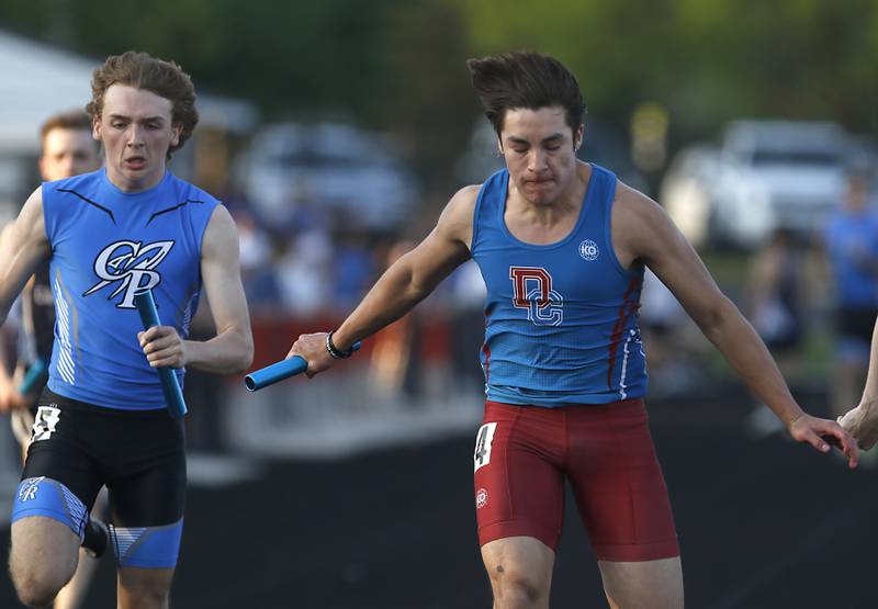 Dundee-Crown’s Alekzander Ledezma leans across the finish line as he races the final leg of the 4 x 100 meter relay during Fox Valley Conference boys track and field meet Friday, May 13, 2022, at Crystal Lake Central High School.