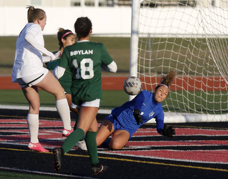 Huntley's Peyton Kohn kicks the ball past Boylan Catholic' goalkeeper Natalya Razo to tie the game during a nonconference soccer game on Wednesday, March 27, 2024, at Huntley High School.