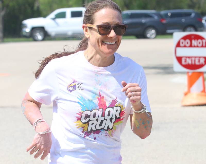 Kati Stevenson of Mendota, finishes in second place during the Color Fun Run on Sunday, April 26, 2026 at Lake Mendota.