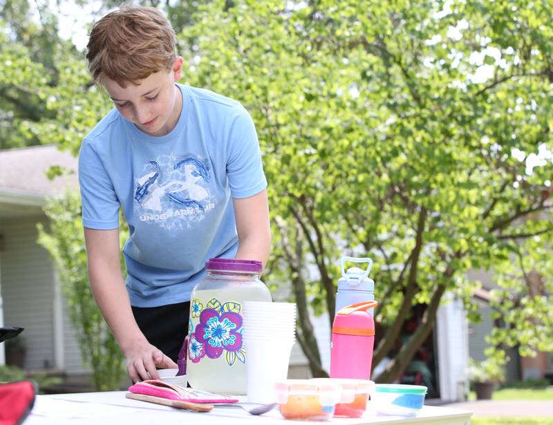 Gavin Conry pours a fresh glass of homemade lemonade in the Clarks Hill neighborhood on Monday, July 15, 2024 near Utica.