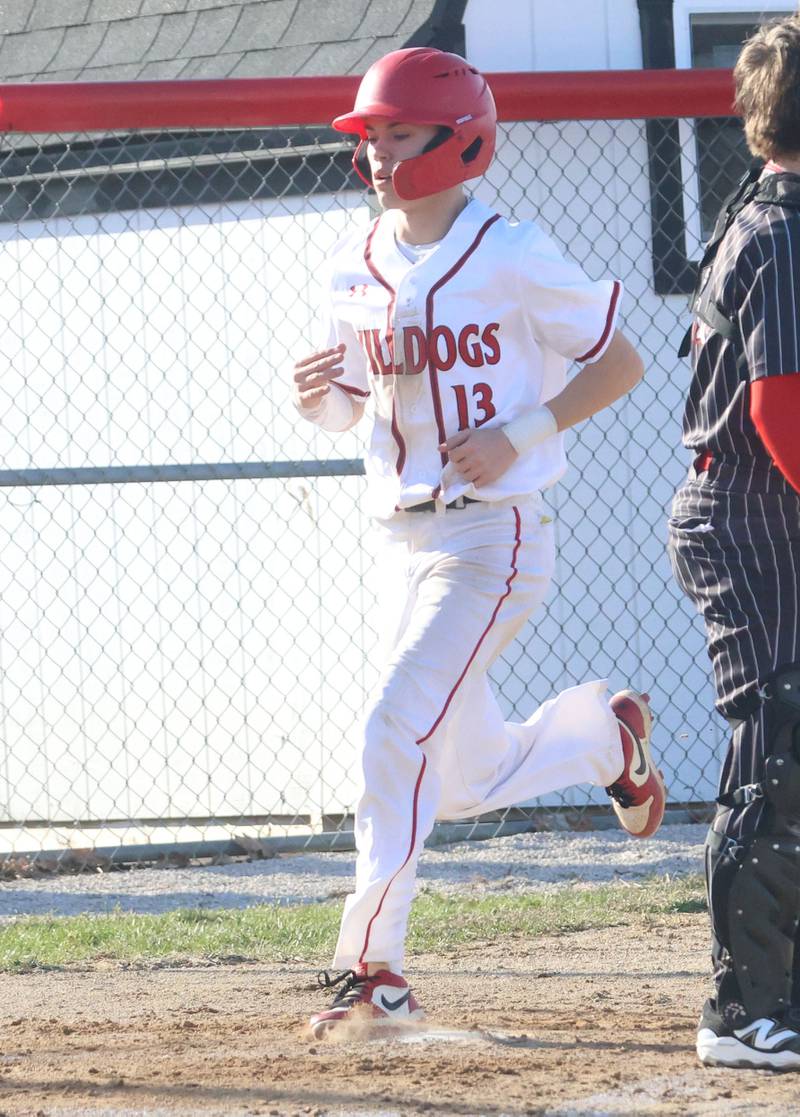 Streator's Issac Melvin crosses home plate against Hall on Thursday, March 19, 2026 at Streator High School.