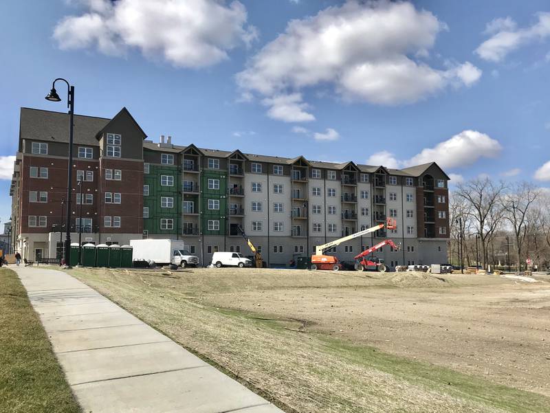 Developers of the $69 million The Reserve at Hudson Crossing development in downtown Oswego are seeking village approval to construct a second apartment building on a vacant lot at the northwest corner of Jackson and Adams Streets, foreground above.