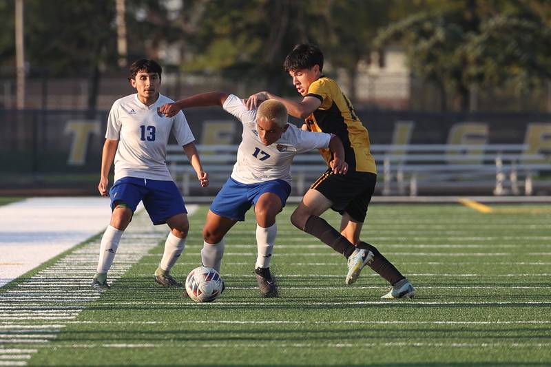 Joliet Central’s Gilberto Rios battles though the defense of Joliet West on Tuesday, Oct. 3, 2023 in Joliet.