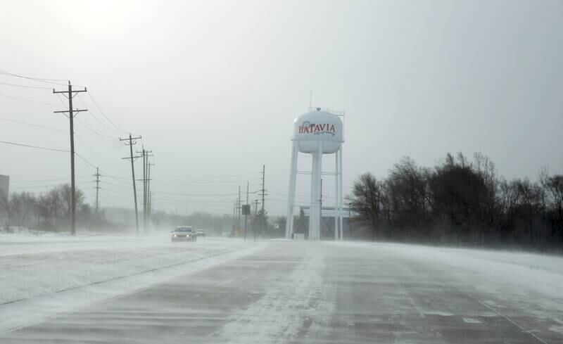 Blowing snow across Kirk Road in Batavia in temperatures below zero on Friday, Dec. 23, 2022.