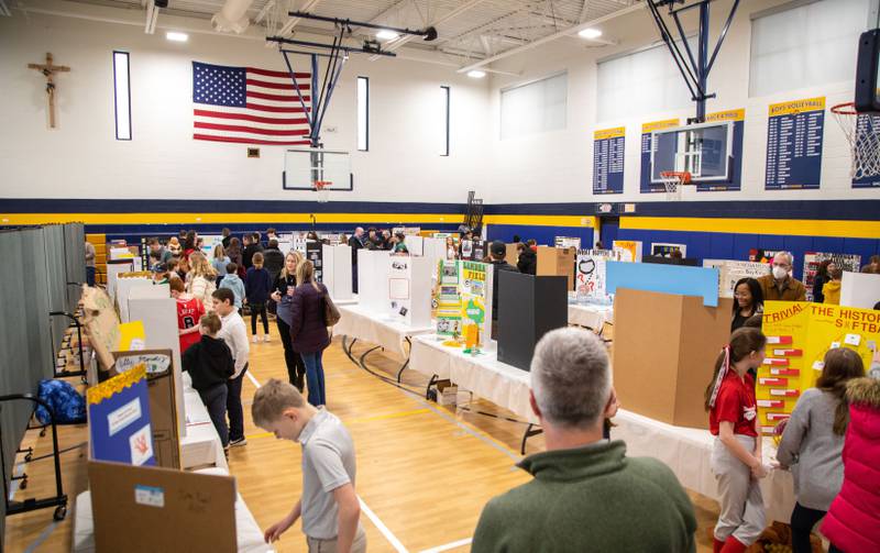 Fifth graders presentation’s line the gym at Saint Mary of Gostyn School's  Open House in Downers Grove on Sunday, Jan. 29, 2023.