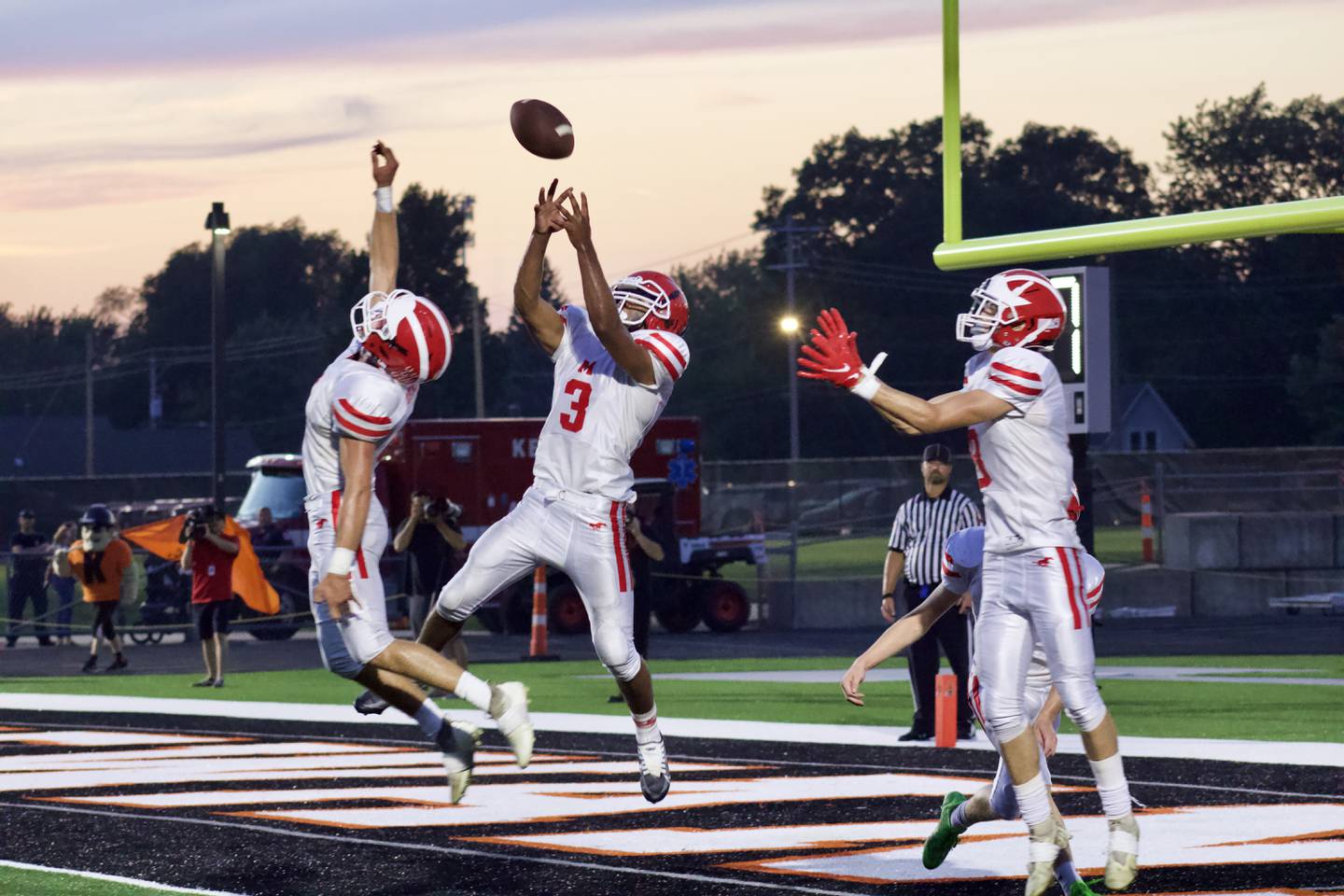 Blake Adams (8) and Daeshaun McQueen (3) make an attempt to intercept and errant toss by Kewanee placeholder Devin Hamrick on a flubbed field goal try on Friday. Kewanee won 16-14.