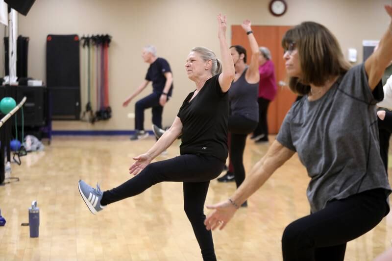 Karen Samata (left) and Barb Brown (right) participate in a fitness class for active older adults at Ackerman Sports and Fitness Center in Glen Ellyn on Friday, Jan. 5, 2024.