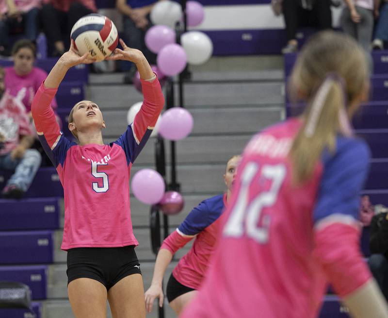 Dixon’s Morgan Hargrave sets the ball against Genoa-Kingston Thursday, Oct. 17, 2024.
