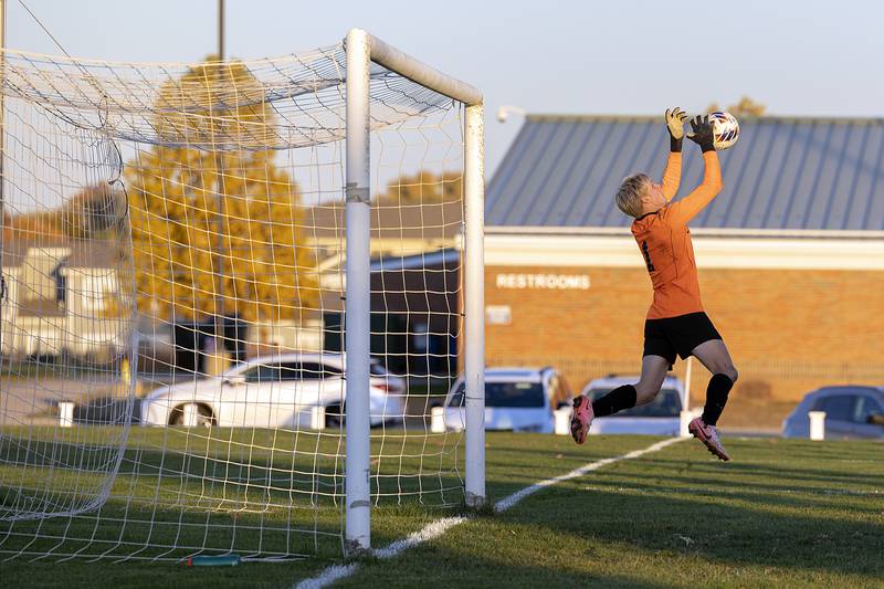 Dunlap goalie Joseph Heiar hauls in a shot on goal against Sterling Wednesday, Oct. 23, 2024, during the class 2A soccer regional semifinal in Geneseo.