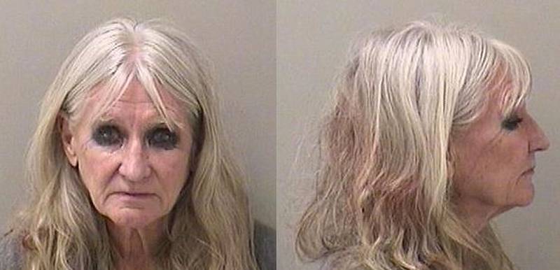 Barbara A. Treiber was charged with driving under the influence, improper lane use, disobeying a stop sign and failure to report damage.