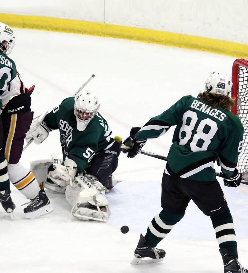 Crystal Lake South goalie Josh Albrecht makes a save during Friday's Blackhawk Cup White State Tournament championship against Loyola Academy at the Edge Ice Arena in Bensenville. The Gators lost 6-1.