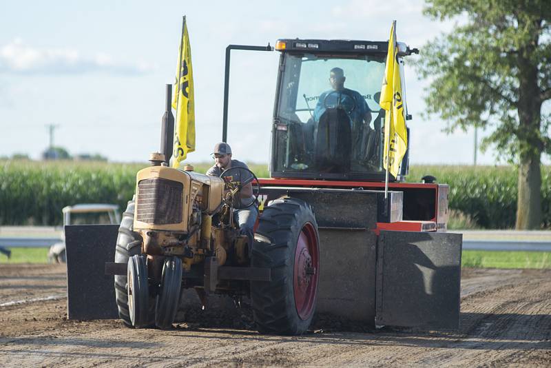 James McCormick gives it the gas Thursday, July 28, 2022 during the 4750 tractor class pulls at the Lee County 4H fair.