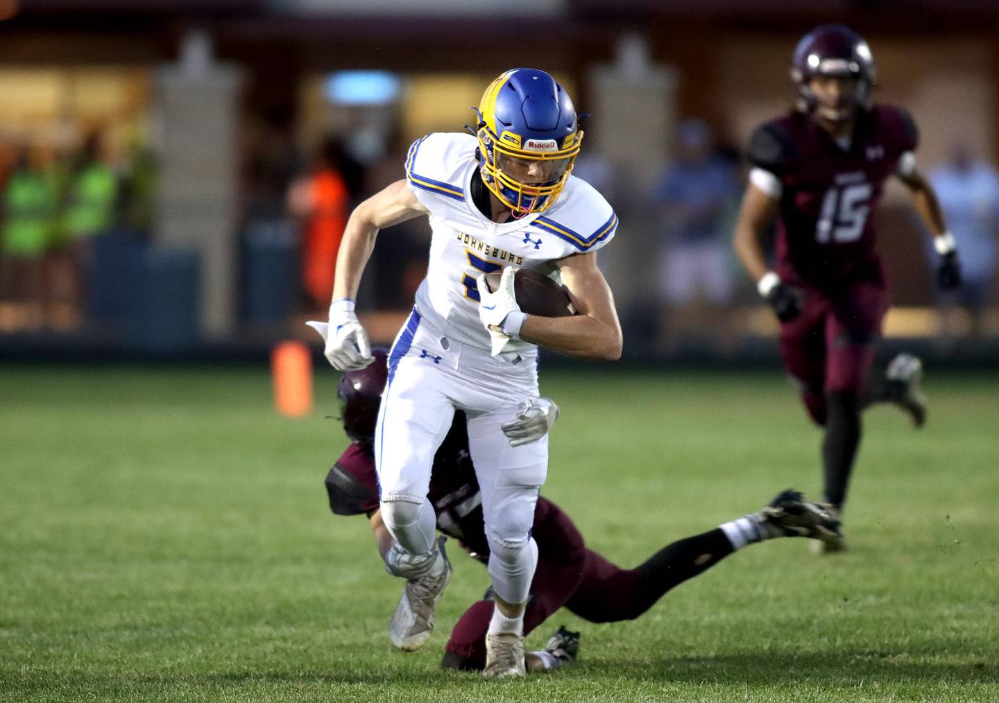 Johnsburg’s Ian Boal runs the ball against Marengo during football Friday night in Marengo.