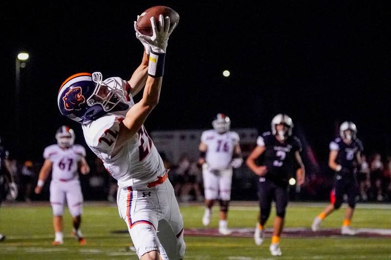 Oswego’s Michael Kelly (22) makes a catch for a touchdown against Plainfield North during a football game at Plainfield North High School on Friday, Sept. 22, 2023.